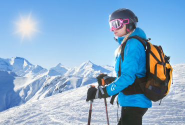 Female skier with beautiful mountain panorama